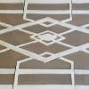Image showing hand-made Ceramic Tortuga Tile mosaic in taupe and white. Created as a stovescape to accompany deco subways tiles.15" x 30" 